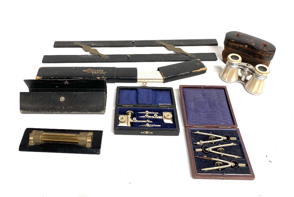 Section of mixed drawing implements, including a parallel rule, three cased draughtsman sets, etc.