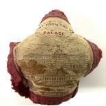 A Victorian silk pin cushion 'A PRESENT FROM THE CRYSTAL PALACE', machine embroidered with a view of