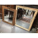 Two gilt framed wall mirrors.