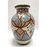 A large Persian ovoid tin glazed earthenware vase, signed to the base, height 30cm.