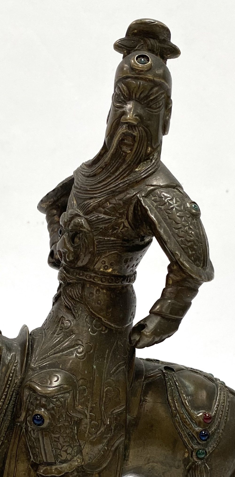 An oriental bronze modelled as a warrior on horseback, inset with glass cabochons (some missing), - Image 4 of 4
