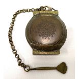 An Islamic copper and brass betel nut hinged container with chain & lime spoon, the hinged box