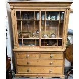 Victorian stripped pine kitchen dresser, the moulded cornice over a pair of glazed doors, the base