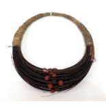 An African tribal elephant hair and red bead necklace, width 21cm.