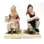 Two Staffordshire figures, one modelled as Sary Gamp, the other a tailor, both seated.