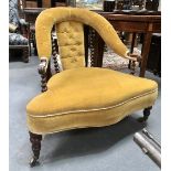A Victorian walnut button back upholstered nursing chair, the yoke back with upholstered rail and