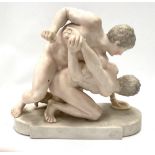 A bisque porcelain painted group depicting two nude wrestlers stamped No.1251 15, height 21cm.