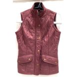A Barbour ladies burgundy quilted gilet, size 10, length 64cm
