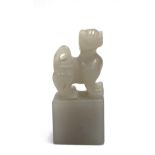 Chinese grey jade seal with faux dog finial, height 53mm.