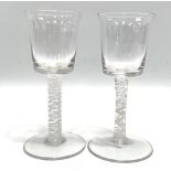 A good pair of Georgian wine glasses with white opaque air twist stems and on circular foot,
