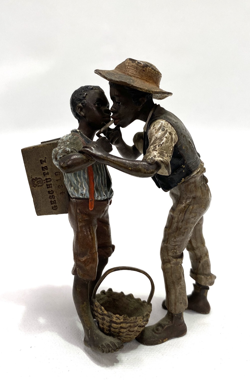 A good cold painted bronze Austrian group by Bergmann, modelled as two African-American children,