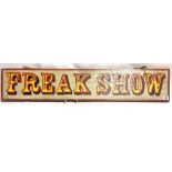Wooden painted circus sign 'FREAK SHOW', length 105cm