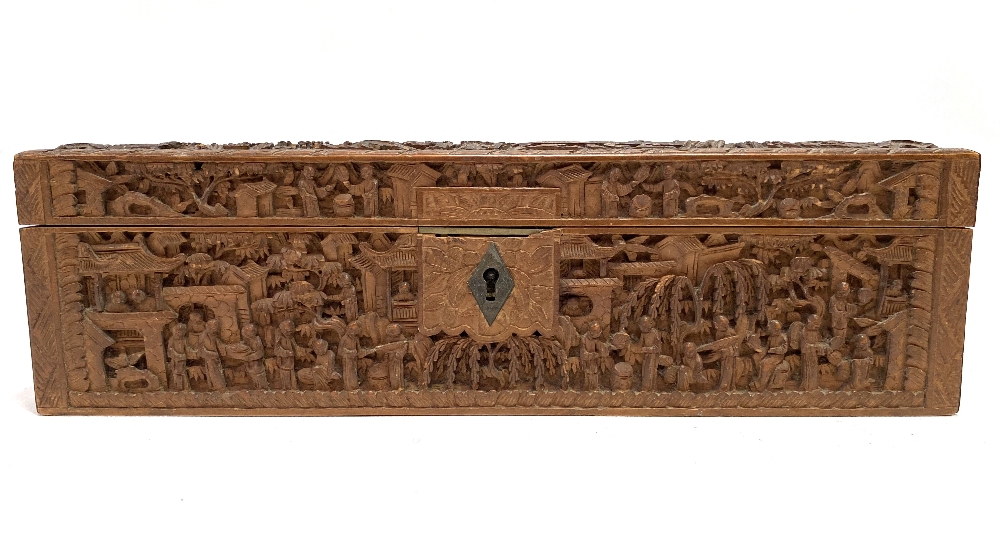 A 19th century Cantonese carved wood rectangular hinge lidded box, profusely carved all over with