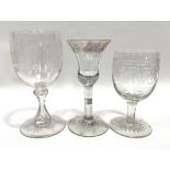 A George III funnel shaped wine glass with circular stem and foot, the rim with fruiting vine