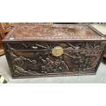 Good 19th Century Chinese hardwood carved camphor wood lined blanket box, the hinged lid carved with