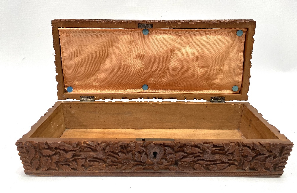 An Indian carved teak rectangular hinge lidded stationery box, with caddy top, the whole profusely - Image 3 of 3