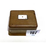 A walnut two section stamp box, the hinged lid with an enamel on metal envelope applied, width 7cm.