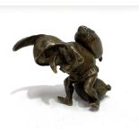 A small bronze gnome figure, modelled carrying a bag, height 4.5cm.