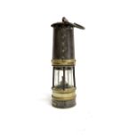 An Ackroyd & Best Ltd (Hailwoods Improved Lamp) no. 8 brass and steel miner's lamp, height 27cm.