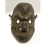 A Japanese carved Noh mask, height 20cm.