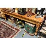 Victorian stripped pine long slender kitchen table with single end drawer and on four turned legs,