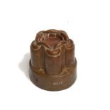 Victorian copper jelly mould of lobed form, the top moulded as a chain link, stamped M443, height