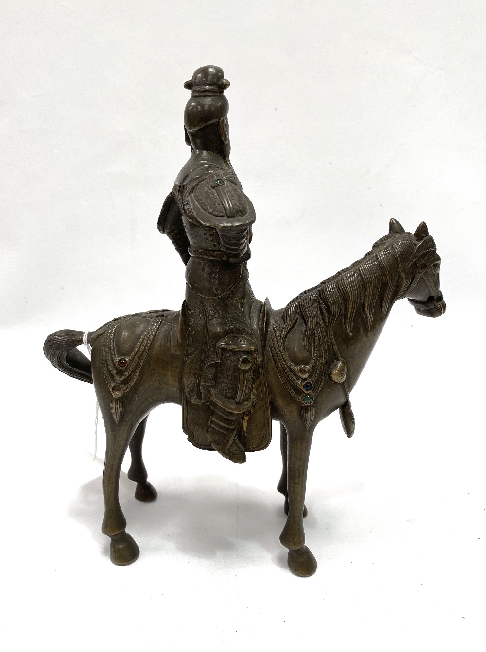 An oriental bronze modelled as a warrior on horseback, inset with glass cabochons (some missing), - Image 2 of 4