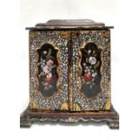 A Victorian black lacquer abalone inlaid painted and gilded jewellery cabinet, the hinged caddy
