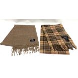 A Barbour brown tartan, fringed lambswool scarf, 27 x 166cm and a Ballantrae biscuit brown,