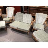 Ercol pale beech wood 'Windsor' three piece lounge suite, comprising two seater sofa and a pair of