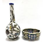 A Persian lobed tin glazed bowl, foliate scroll decorated, together with a Persian bottle vase (