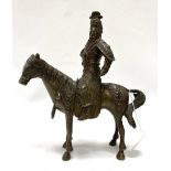 An oriental bronze modelled as a warrior on horseback, inset with glass cabochons (some missing),