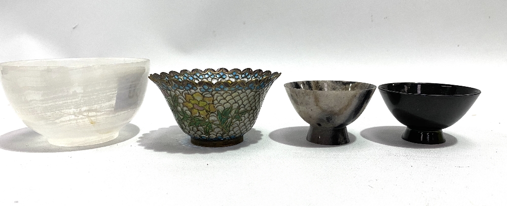 Two turned hardstone bowls, the largest diameter 8.5cm, together with an applique jour bowl (3).