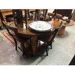Victorian oak oval extending dining table with two extra leaves raised on four turned feet and