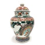 A Chinese famille verte lidded baluster vase decorated with a reserve of an empress in a tent with