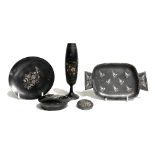 A collection of five gun metal silver inlaid wares, to include a brooch, a scallop shell lidded box,