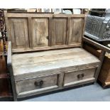 Pine bench with four fielded panel back, the seat with two drawers under, width 125cm.