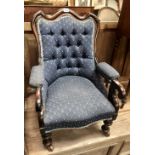 Victorian mahogany button back upholstered child's salon chair raised on turned forelegs and ceramic