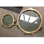 Two brass framed portholes, the largest diameter 50cm, the smaller 30cm.