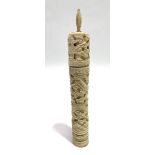 A Chinese carved bone cylindrical lidded bodkin case, carved with a coiling dragon amongst clouds,
