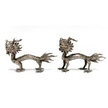 A pair of Chinese silver dragon menu holders, stamp mark to foot, length 8cm.