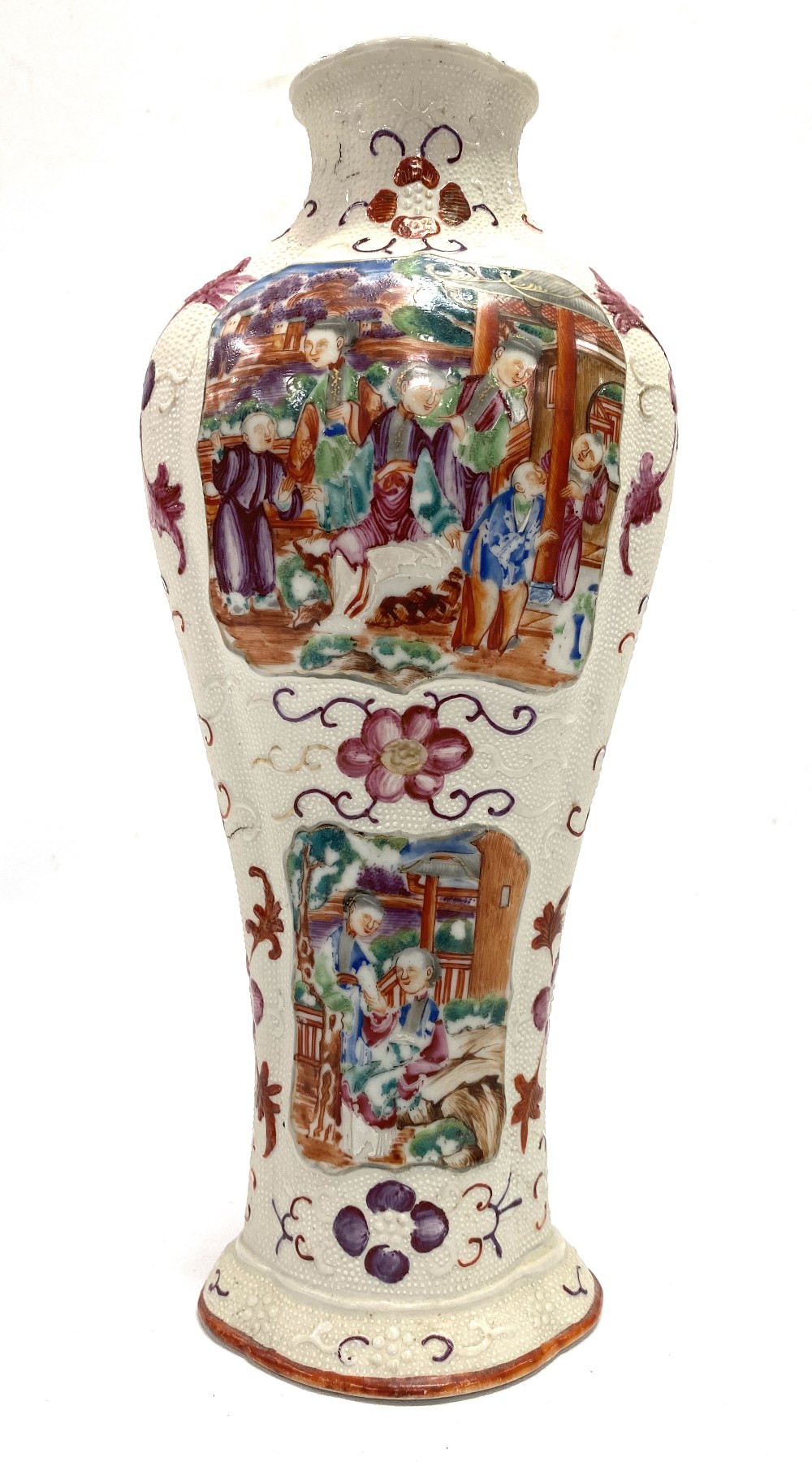 A Chinese famille rose vase, of lobed baluster section, decorated with panels in relief painted with