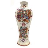 A Chinese famille rose vase, of lobed baluster section, decorated with panels in relief painted with