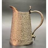 Indian white metal foliate scroll embossed jug with serpent handle, height 9cm, weight 118g approx.