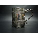 Good Victorian silver mug with original burgundy Moroccan leather gilt tooled case, the mug with two