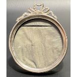 Edwardian silver circular photograph frame with ribbon surmount, maker HM, Birmingham 1902, diameter