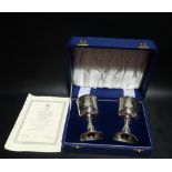 Boxed pair of Churchill Centenary silver goblets by Toye Kenning & Spencer, with applied portraits