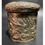 Victorian silver cylindrical lidded box, foliate scroll embossed and with a bird and serpent,