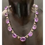 Good Victorian silver amethyst set thirteen stone necklace, the oval cut stones interspersed with