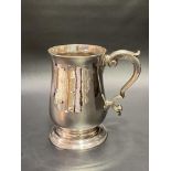 Good George III silver baluster footed mug with scroll handle, maker's mark .K (partial mark